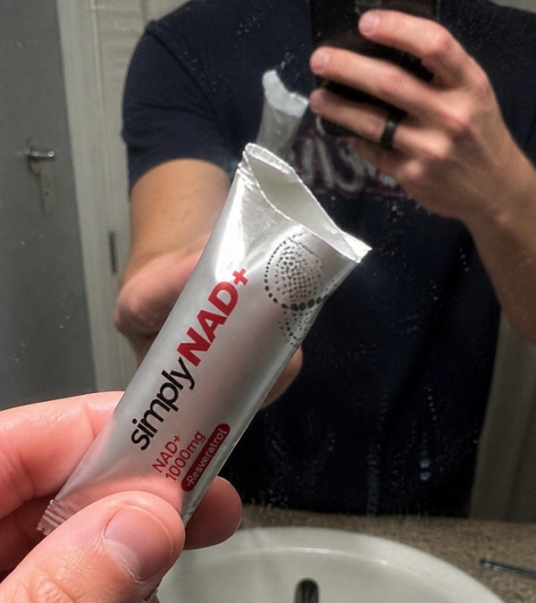 simplyNAD+ liquid NAD+ shot packet in an everyday setting