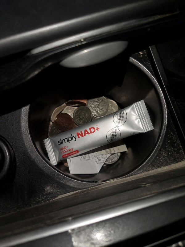 simplyNAD+ liquid NAD+ shot packet in an everyday setting