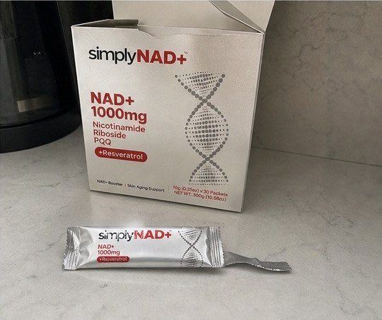 simplyNAD+ liquid NAD+ shot packet in an everyday setting