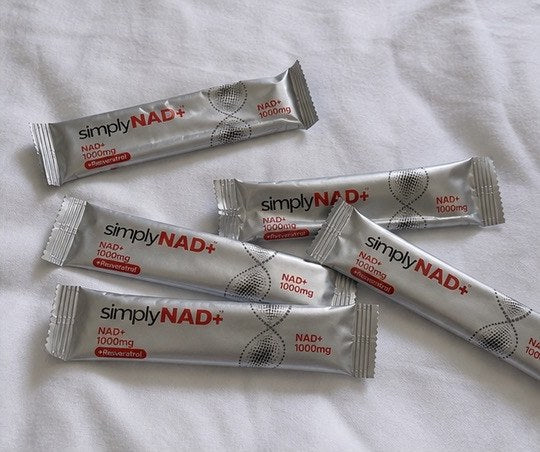 simplyNAD+ liquid NAD+ shot packet in an everyday setting